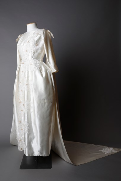 Cream satin wedding dress with a double train - New Zealand Fashion Museum